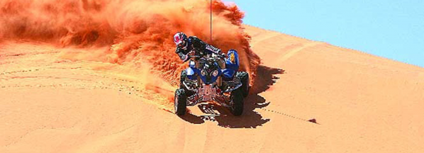 a four-wheeler on a sand dune